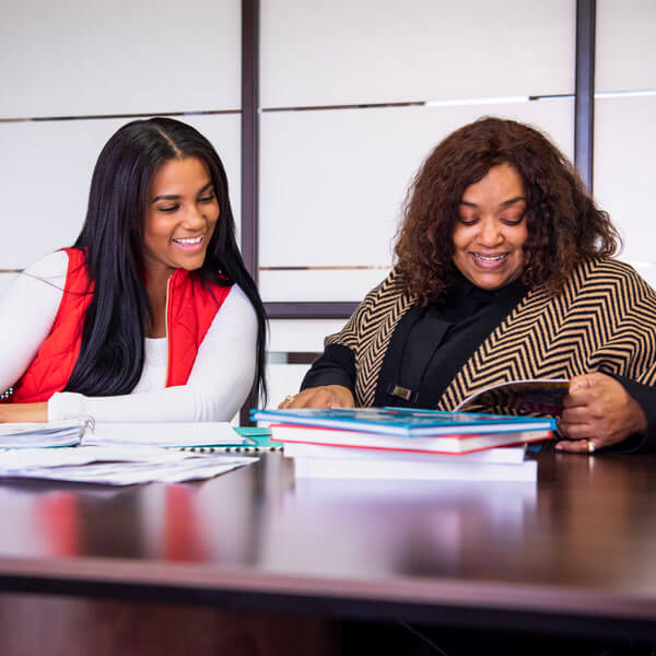 A financial aid counselor works with her student.