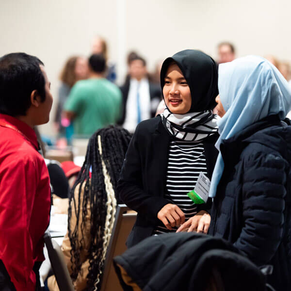 Students chat at a leadership conference.