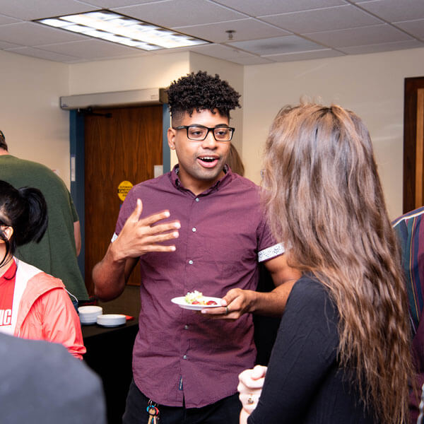 Students chat at a conference at the Stevenson Center.